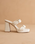 The Faith | White Knotted band platform snake-print heel