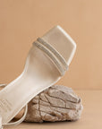The Suva | White Rhinestone and reptile print strappy heel